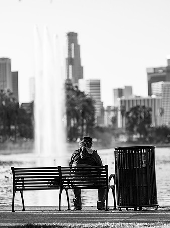 Man Sitting On A Park Bench